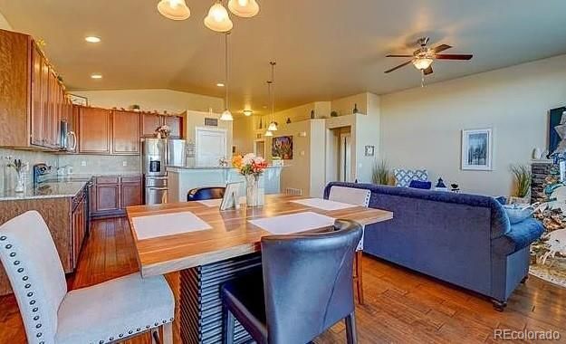 Dining room, Interior, Kitchen, Living room, Pendant Lights, Recessed Lighting, Stainless Steel Appliances, Wood Texture Flooring