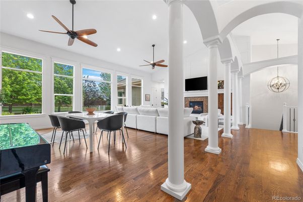 Dining room, Fireplace, Interior, Living room, Recessed Lighting, Wood Texture Flooring