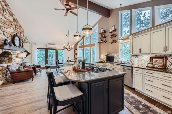 Chandelier, Dining room, Fireplace, Interior, Kitchen, Living room, Pendant Lights, Stone Walls, Wooden Beams, Wood Texture Flooring