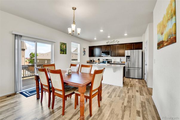 Dining room, Interior, Kitchen, Pendant Lights, Recessed Lighting, Stainless Steel Appliances, Wood Texture Flooring