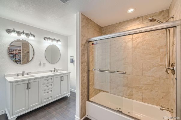 Bathroom, Dual Sink Vanities, Glass Shower, Interior, Recessed Lighting, Wood Texture Flooring