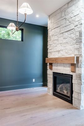 Empty room, Fireplace, Interior, Pendant Lights, Recessed Lighting, Stone Walls, Wood Texture Flooring