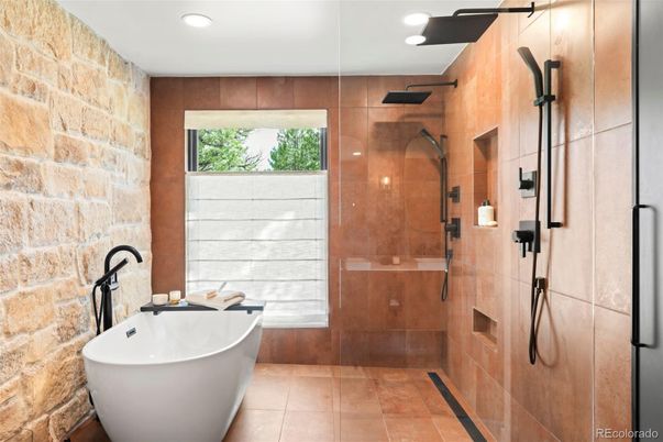 Bathroom, Free Standing Baths, Glass Shower, Interior, Recessed Lighting, Stone Walls