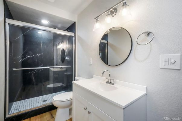Bathroom, Glass Shower, Interior, Marble Walls, Recessed Lighting, Wood Texture Flooring