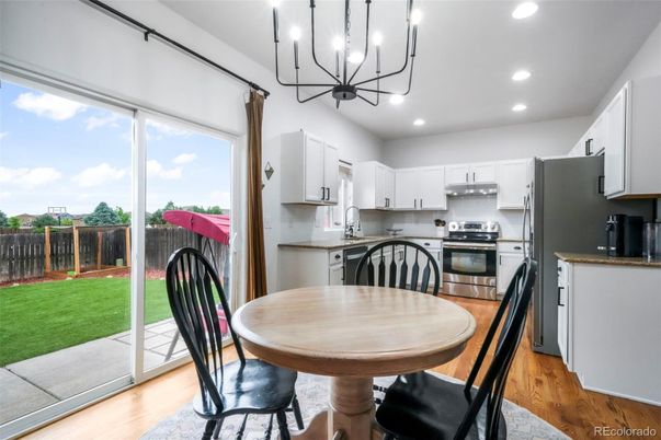 Chandelier, Dining room, Interior, Kitchen, Recessed Lighting, Stainless Steel Appliances, Wood Texture Flooring
