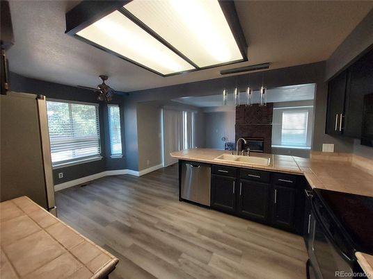 Interior, Kitchen, Pendant Lights, Tile Countertops, Wood Texture Flooring