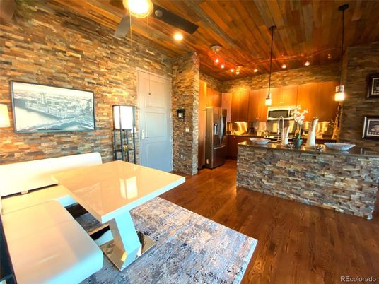 Dining room, Interior, Kitchen, Pendant Lights, Recessed Lighting, Stainless Steel Appliances, Stone Walls, Wooden Ceilings, Wood Texture Flooring, Wooden Walls