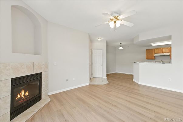 Empty room, Fireplace, Interior, Kitchen, Pendant Lights, Wood Texture Flooring
