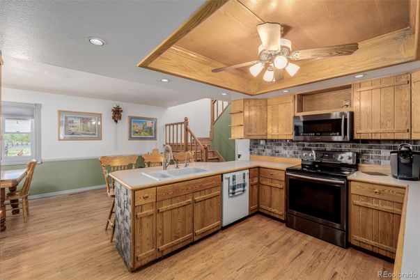Dining room, Interior, Kitchen, Recessed Lighting, Stainless Steel Appliances, Wood Texture Flooring