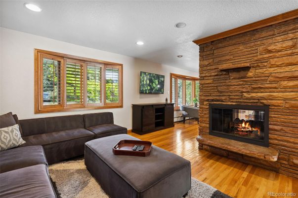 Fireplace, Interior, Living room, Recessed Lighting, Stone Walls, Wood Texture Flooring, Wooden Walls