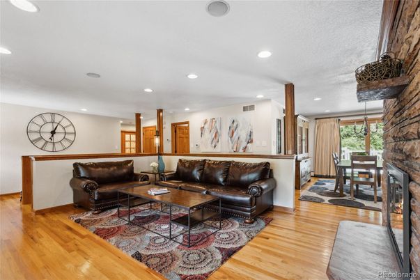 Dining room, Fireplace, Interior, Living room, Recessed Lighting, Wood Texture Flooring