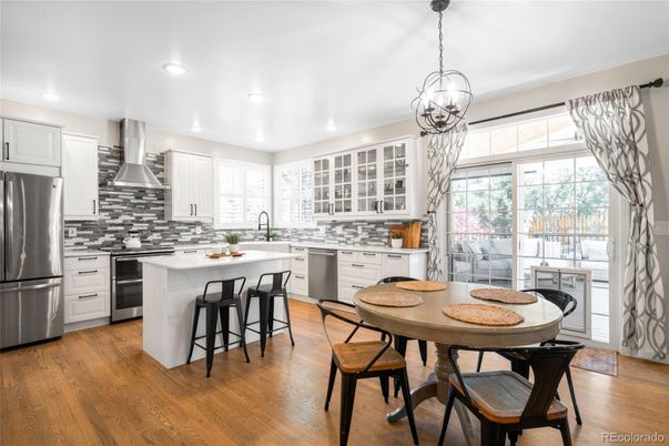 Dining room, Interior, Kitchen, Pendant Lights, Recessed Lighting, Stainless Steel Appliances, Wood Texture Flooring