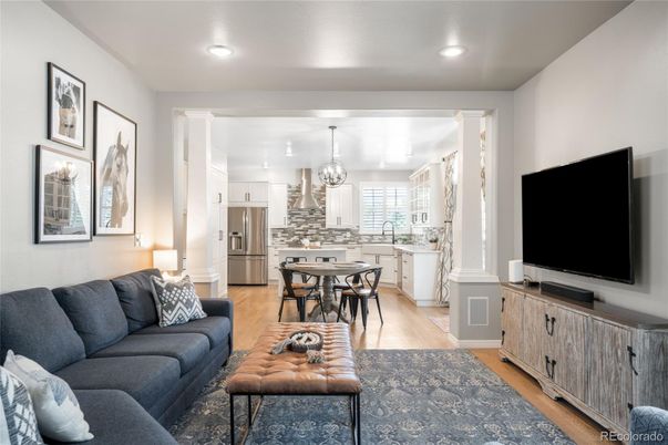 Chandelier, Dining room, Interior, Kitchen, Living room, Recessed Lighting, Stainless Steel Appliances, Wood Texture Flooring