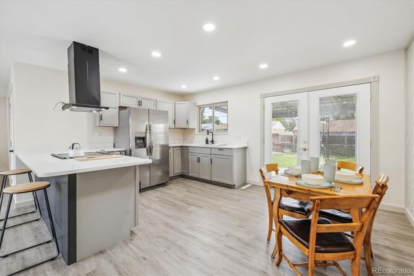 Dining room, Interior, Kitchen, Recessed Lighting, Stainless Steel Appliances, Wood Texture Flooring
