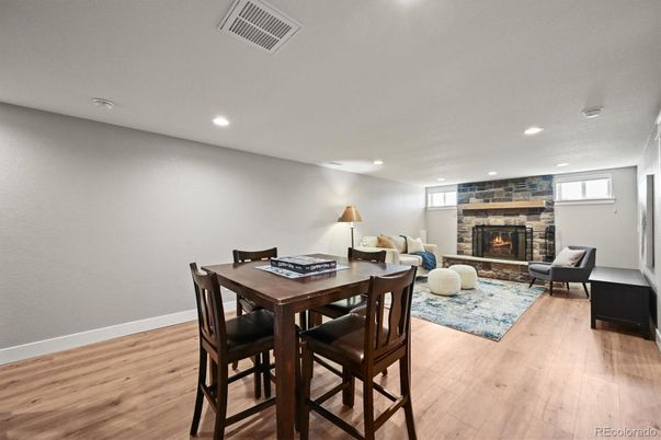 Dining room, Fireplace, Interior, Living room, Recessed Lighting, Wood Texture Flooring