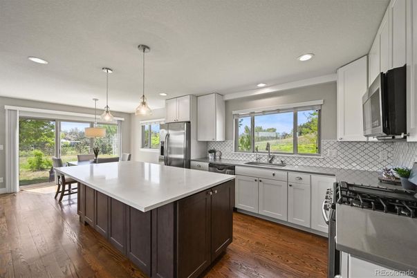 Dining room, Interior, Kitchen, Pendant Lights, Recessed Lighting, Stainless Steel Appliances, Wood Texture Flooring