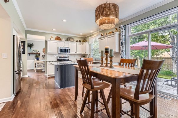 Chandelier, Dining room, Interior, Kitchen, Recessed Lighting, Stainless Steel Appliances, Wood Texture Flooring