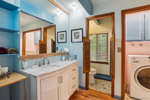 Bathroom, Dual Sink Vanities, Interior, Washer, Wood Texture Flooring