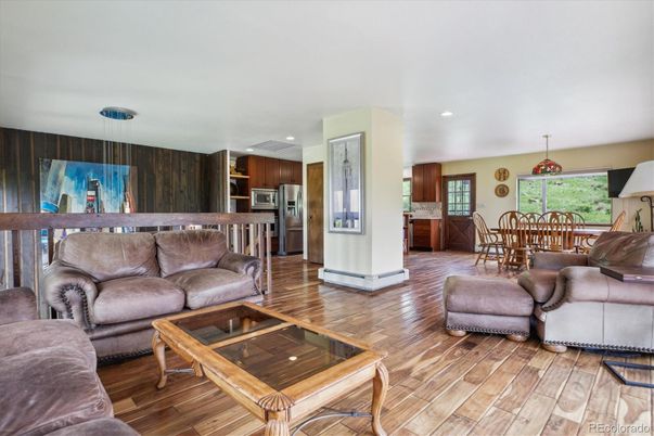 Dining room, Interior, Kitchen, Living room, Pendant Lights, Recessed Lighting, Stainless Steel Appliances, Wood Texture Flooring