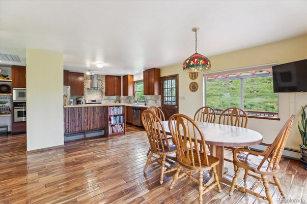 Dining room, Interior, Kitchen, Pendant Lights, Stainless Steel Appliances, Wood Texture Flooring