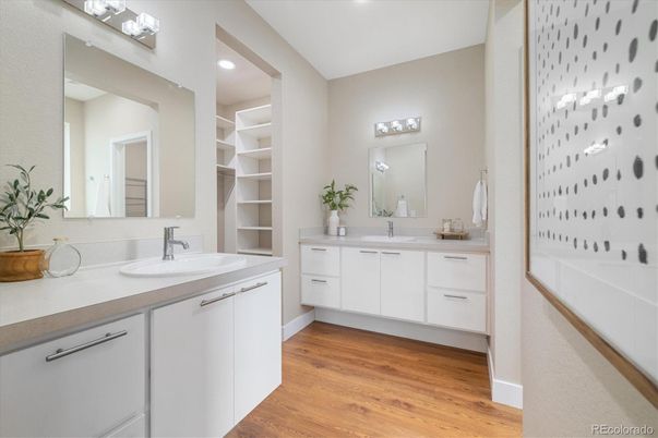 Bathroom, Dual Sink Vanities, Interior, Recessed Lighting, Walk-in Closets, Wood Texture Flooring