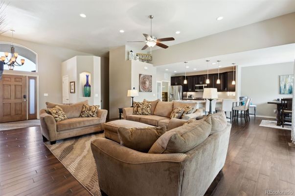 Chandelier, Dining room, Interior, Kitchen, Living room, Pendant Lights, Recessed Lighting, Stainless Steel Appliances, Wood Texture Flooring