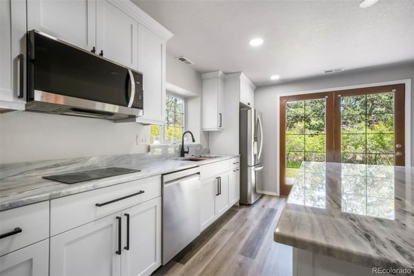Interior, Kitchen, Recessed Lighting, Stainless Steel Appliances, Wood Texture Flooring