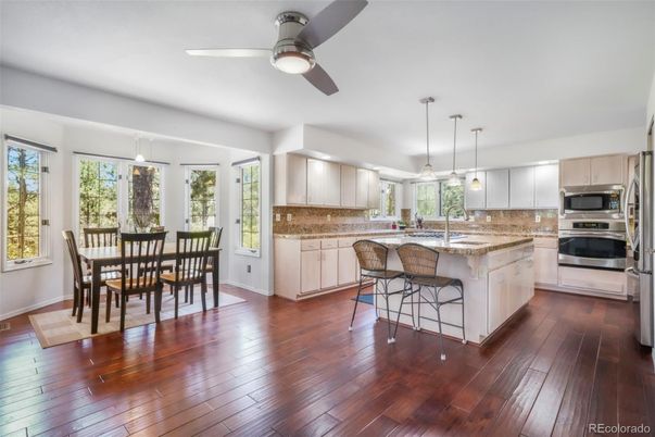 Dining room, Interior, Kitchen, Pendant Lights, Stainless Steel Appliances, Wood Texture Flooring