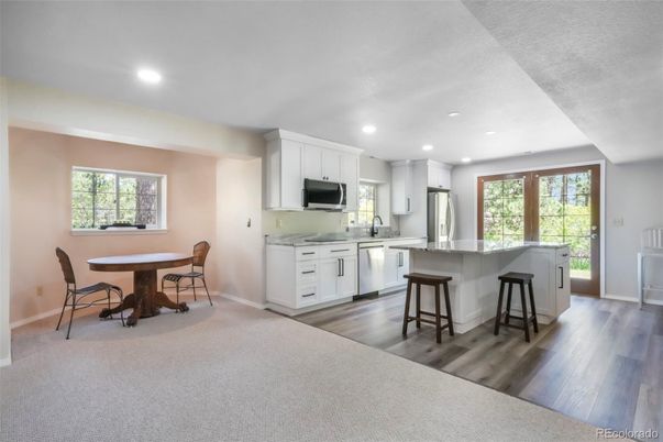 Dining room, Interior, Kitchen, Recessed Lighting, Stainless Steel Appliances, Wood Texture Flooring