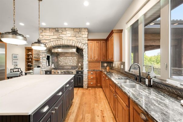 Interior, Kitchen, Pendant Lights, Recessed Lighting, Stainless Steel Appliances, Stone Walls, Wood Texture Flooring