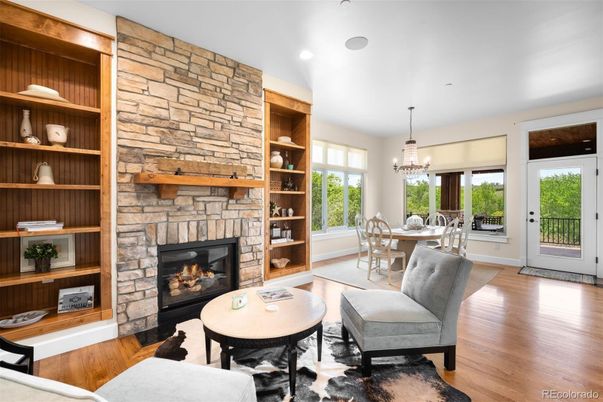 Chandelier, Dining room, Fireplace, Interior, Pendant Lights, Recessed Lighting, Stone Walls, Wood Texture Flooring
