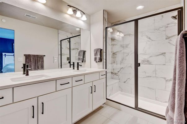 Bathroom, Dual Sink Vanities, Glass Shower, Interior, Marble Walls, Recessed Lighting