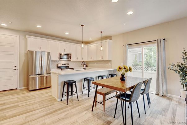 Dining room, Interior, Kitchen, Pendant Lights, Recessed Lighting, Stainless Steel Appliances, Wood Texture Flooring