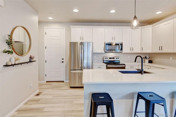 Interior, Kitchen, Pendant Lights, Recessed Lighting, Stainless Steel Appliances, Wood Texture Flooring