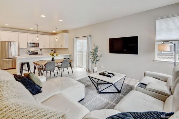 Dining room, Interior, Kitchen, Living room, Pendant Lights, Recessed Lighting, Stainless Steel Appliances, Wood Texture Flooring