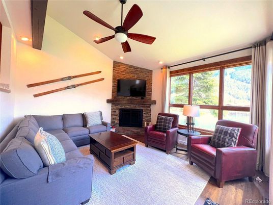 Fireplace, Interior, Living room, Recessed Lighting, Stone Walls, Wood Texture Flooring