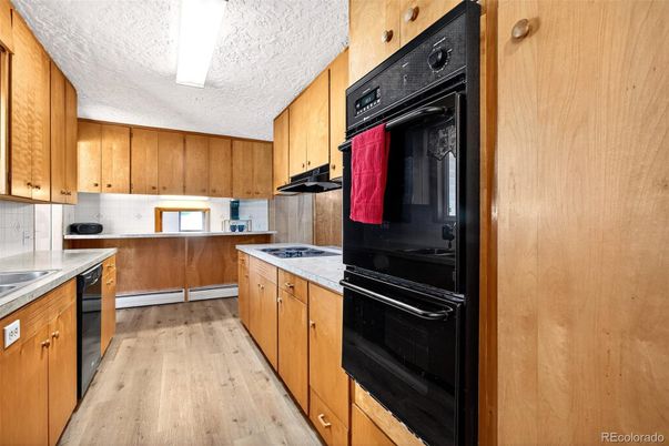 Interior, Kitchen, Tile Countertops, Wood Texture Flooring