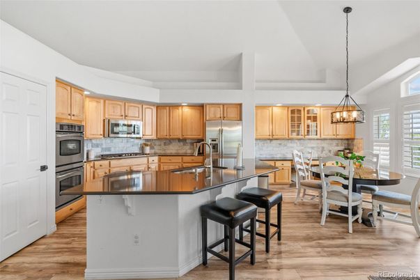 Dining room, Interior, Kitchen, Pendant Lights, Recessed Lighting, Stainless Steel Appliances, Wood Texture Flooring