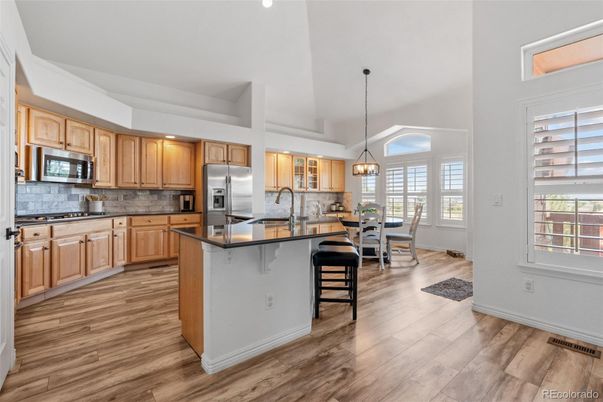 Dining room, Interior, Kitchen, Pendant Lights, Recessed Lighting, Stainless Steel Appliances, Wood Texture Flooring