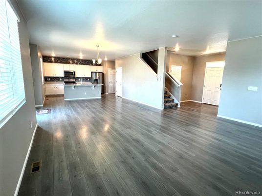 Empty room, Interior, Kitchen, Pendant Lights, Stainless Steel Appliances, Wood Texture Flooring