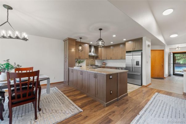 Dining room, Interior, Kitchen, Pendant Lights, Recessed Lighting, Stainless Steel Appliances, Wood Texture Flooring