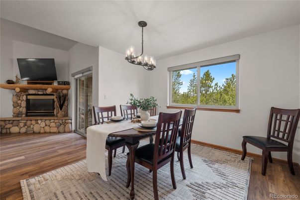 Chandelier, Dining room, Fireplace, Interior, Pendant Lights, Wood Texture Flooring