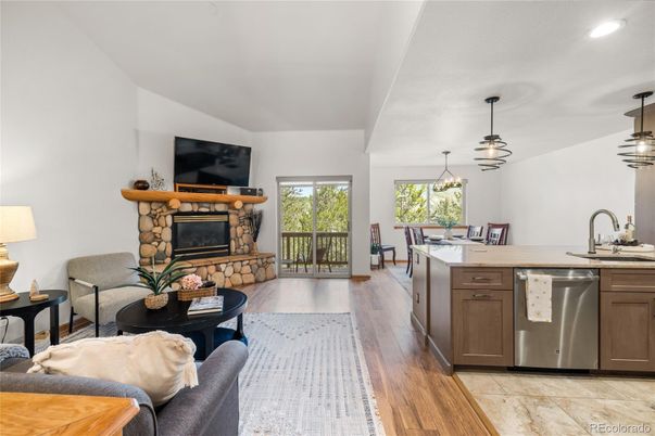 Dining room, Fireplace, Interior, Kitchen, Living room, Pendant Lights, Recessed Lighting, Stainless Steel Appliances, Wood Texture Flooring