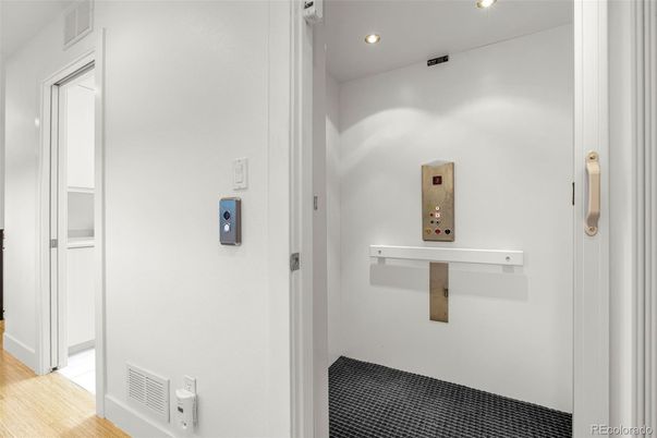 Elevator, Interior, Recessed Lighting, Wood Texture Flooring