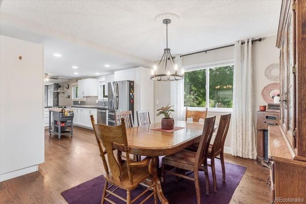 Dining room, Interior, Kitchen, Pendant Lights, Recessed Lighting, Stainless Steel Appliances, Wood Texture Flooring