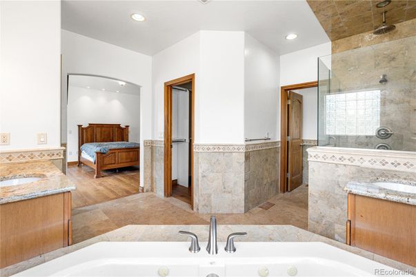 Bathroom, Dual Sink Vanities, Glass Shower, Interior, Recessed Lighting, Wood Texture Flooring