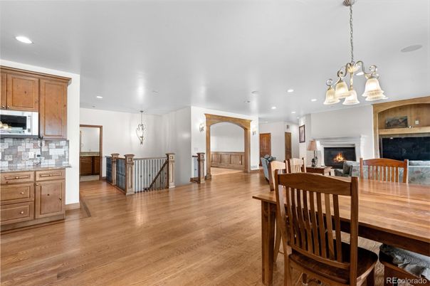 Chandelier, Dining room, Fireplace, Interior, Kitchen, Pendant Lights, Recessed Lighting, Wood Texture Flooring