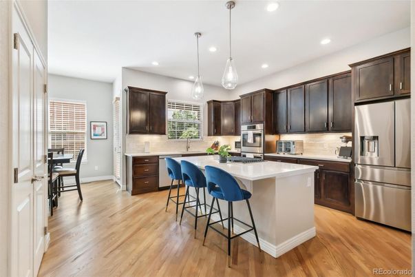 Dining room, Interior, Kitchen, Pendant Lights, Recessed Lighting, Stainless Steel Appliances, Wood Texture Flooring