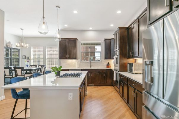 Chandelier, Dining room, Interior, Kitchen, Pendant Lights, Recessed Lighting, Stainless Steel Appliances, Wood Texture Flooring