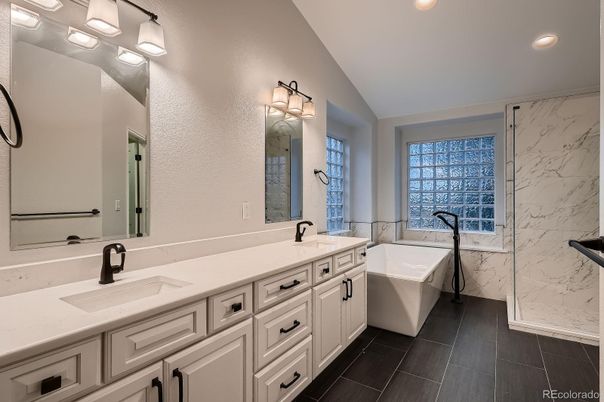 Bathroom, Dual Sink Vanities, Free Standing Baths, Glass Shower, Interior, Marble Walls, Recessed Lighting
